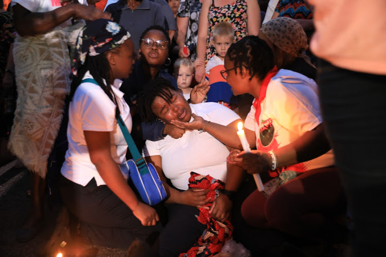 A woman breaks down at a memorial service for the 27 people who lost their lives when a gas tanker exploded in Boksburg. Those who lost loved ones lit candles and prayed while many brought ribbons when residents from Boksburg and neighbouring townships came together to remember those who died.