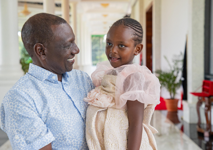 President William Ruto with four-year-old Tinsley Nduta at the State House on May 19, 2024.