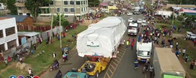 Bungoma residents throng the streets view the 'strange' load.