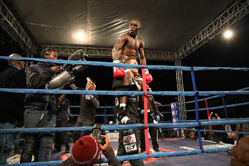 NEW CHALLENGE: Xolisani ‘Nomeva’ Ndongeni, seen here celebrating his win with Colin Nathan last November, is no longer IBO champn Picture: MARK ANDREWS