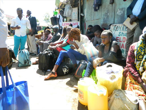 Passengers stranded at the Kakamega bus stop on Monday due to lack of passenger vehicles following reintroduction of Michuki traffic rules.