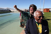 Archbishop Desmond Tutu visiting Darling in the Western Cape on June 23 20101 to view the town's new swimming pool and bless its Health, Sport and Education Centre. Evita Bezuidenhout accompanied him. The Archbishop was patron of the Darling Pool Project and The Darling Trust that was established in August 2003 by Tannie Evita's alter ego, the actor, Pieter-Dirk Uys.