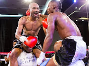 Jackson Chauke (L) is contesting for a world boxing title 