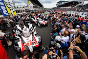 The #07 Toyota Gazoo Racing TS050 Hybrid of Mike Conway, Kamui Kobayashi, and Jose Maria Lopez and the #08 Toyota Gazoo Racing TS050 Hybrid of Sebastien Buemi, Kazuki Nakajima and Fernando Alonso on the grid during the Le Mans 24 Hour Race at the Circuit de la Sarthe on June 15 2019 in Le Mans, France.