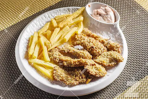 Crunchy Fried Chicken And French Fries With Cheese Sauce