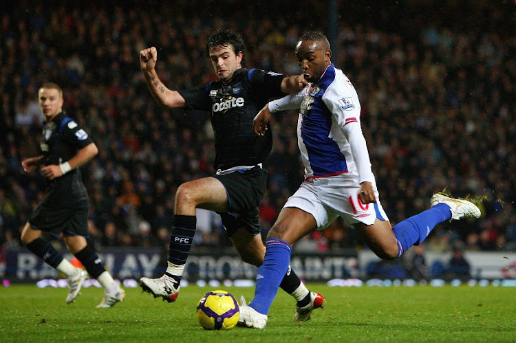 Marc Wilson of Portsmouth tries to block Benni McCarthy of Blackburn Rovers shot at goal during the Barclays Premier League match between Blackburn Rovers and Portsmouth at Ewood Park on November 7, 2009 in Blackburn, England.