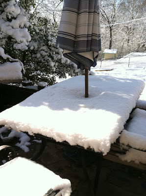Snow sun picnic table umbrella photo Snow sun picnic table umbrella photo
