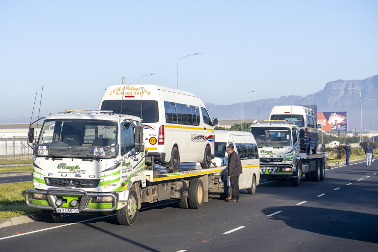 Minibus taxis blocking the road at the Airport Approach and Borcherds Quarry exit were seized in Cape Town on day 5 of the taxi strike on August 7 2023.