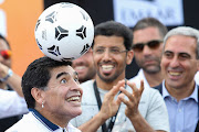 Soccer icon Diego Maradonna shows off his skills. The athlete is the focus of the documentary, Maradonna, by filmmaker Asif Kapadia who looks into his career as one of the most celebrated soccer stars.