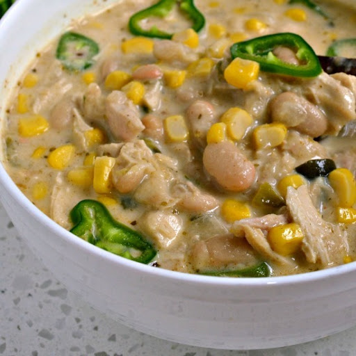 This easy White Chicken Chili recipe is a creamy version of chili with white beans, roasted chicken, cream, poblano peppers and Anaheim peppers.  It is a welcome change from the traditional red chili.