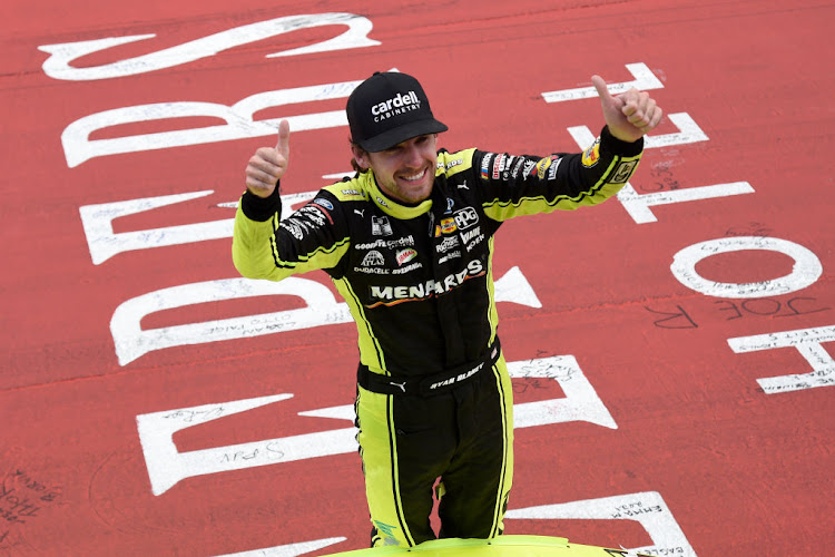 Ryan Blaneyv celebrates after winning the NASCAR Cup Series FireKeepers Casino 400 at Michigan International Speedway on August 22, 2021 in Brooklyn Michigan.