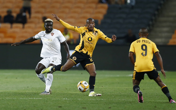 Stellenbosch FC's Ismaël Olivier Touré challenges Wandile Duba of Kaizer Chiefs while Ashley du Preez looks on in the DStv Premiership match at FNB Stadium in Johannesburg on Tuesday night.