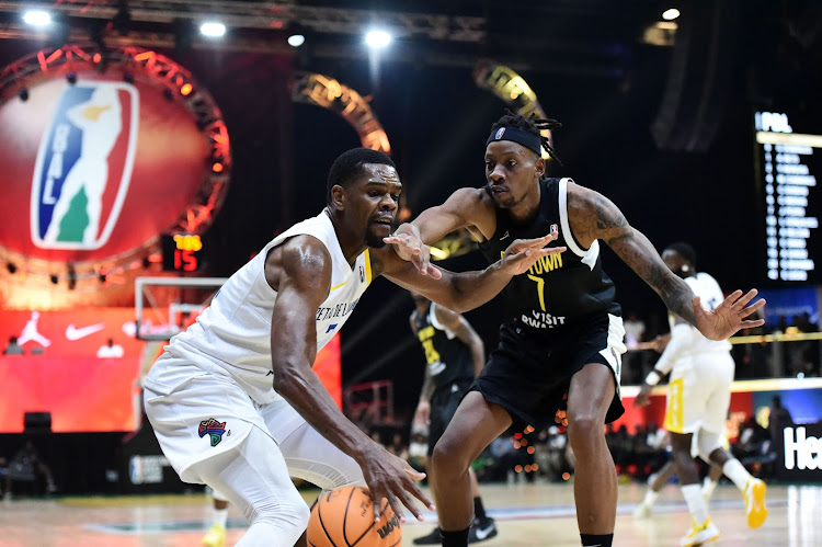 Yanick Moreira of Petro de Luanda is challenged by Somusa Mthembu of Cape Town Tigers during the 2024 BAL Season 4 match at the SunBet Arena in Pretoria on March 10 2024