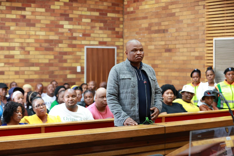 Boinehelo Lefefa, 43, appears in the Westonaria magistrate's court for allegedly stabbing a colleague to death.