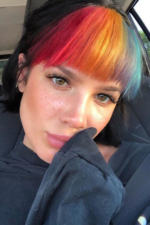 lady spotting multi-color bangs in a car