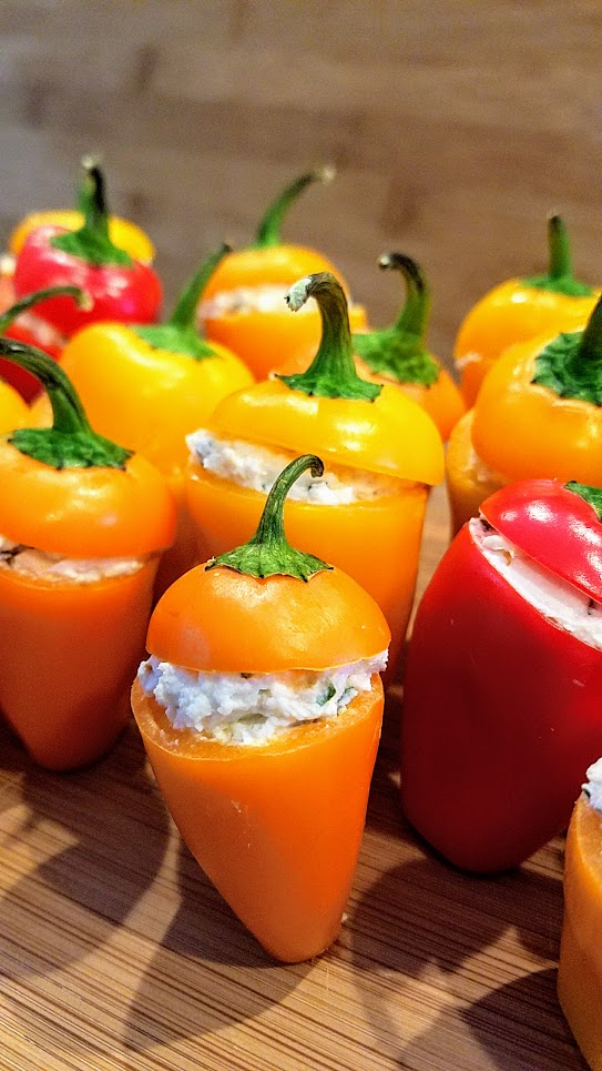 Recipe for Cheese Stuffed Mini Peppers, easy peasy and are adorable because of the way you can get multiple colors with the orange, yellow and red which are so cheerful, and then presentation wise the way they stand up in little rows or formations so bravely