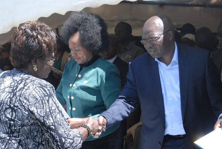 Water CS Simon Chelugui greets mourners during in Baringo county on Saturday.