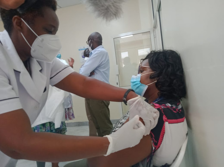 Jerusha Malini, a nurse at KNH, is vaccinated against Covid-19 on March 5, 2021.