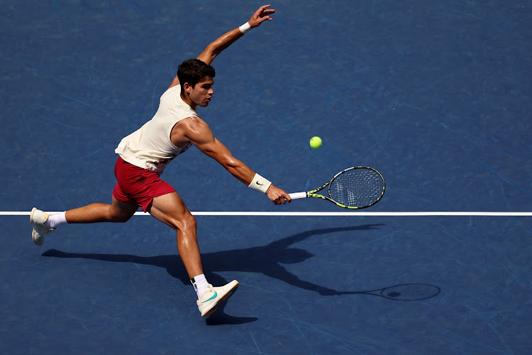 Carlos Alcaraz of Spain plays a backhand volley against Daniel Evans of Great Britain in their third round match on day six of the 2023 US Open at the USTA Billie Jean King National Tennis Centre, New York. Picture: CLIVE BRUNSKILL/GETTY IMAGES