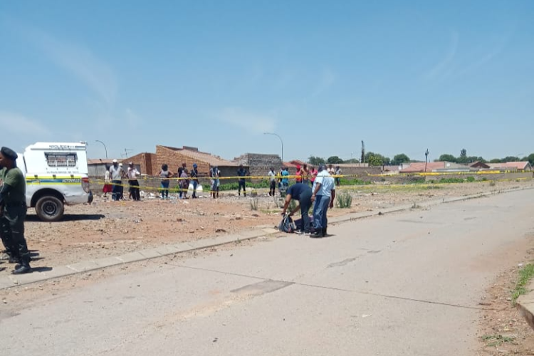 Police on the scene in Watville, Benoni, where the dismembered body of a woman was found in a suitcase on Saturday.