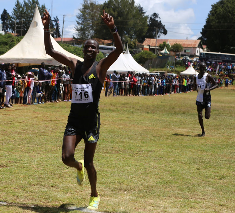 Robert Kiprop celebrates after winning the Iten Athletics Kenya Cross Country meeting at Iten grounds