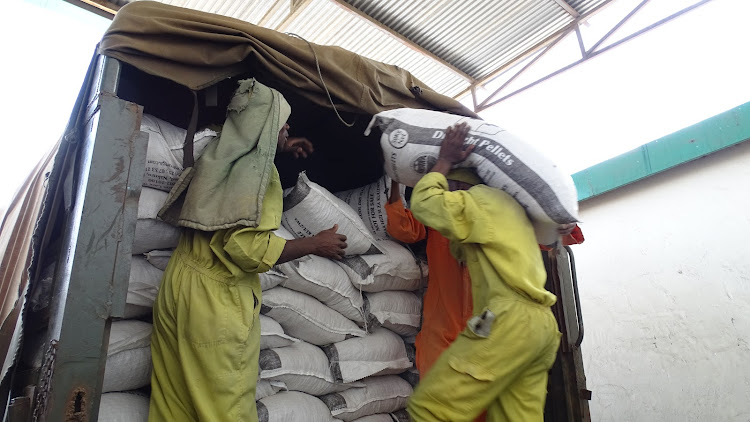 Workers at Unga Farm Care plant in Nairobi load a military truck with livestock feed provided by the National Drought Management Authority.