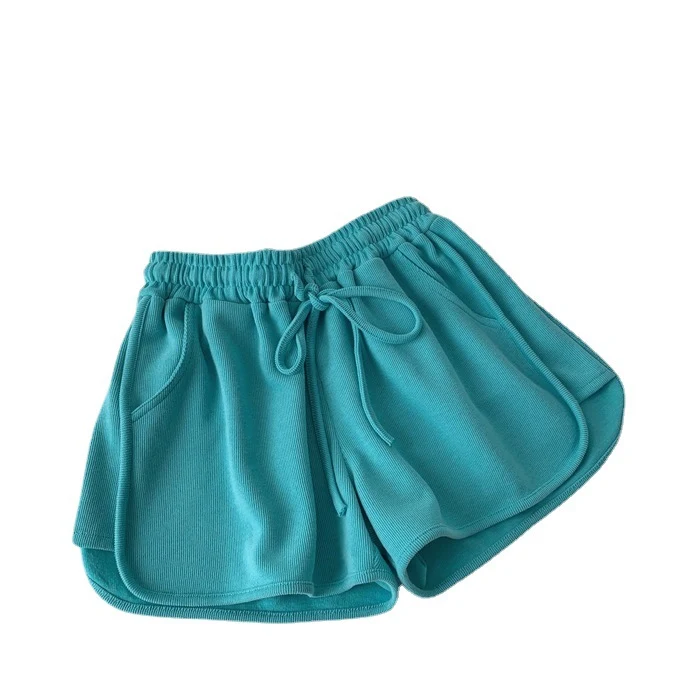Shorts esportivos femininos de cor sólida com pernas largas, soltos e elegantes. Perfeitos para exercícios e atividades com conforto e estilo.