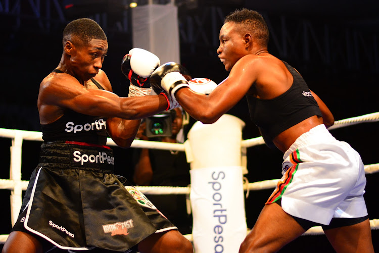 Fatuma Zarika trades punches with Zambia's Catherine Phiri during the SportPesa Night Fight