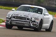 A camouflaged 2021 Ford Mustang Mach 1 being track-tested.