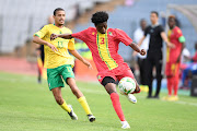 Devin Titus with Djigo Saikou of Congo Brazzaville during the U23 Africa Cup of Nations qualifier at Donsonville Stadium on March 23 2023.