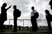 Pupils line up to be screened at a school in Cape Town. File photo.