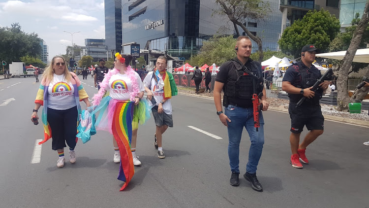 People take part in the Johannesburg Pride march in Sandton amid a heavy security presence.