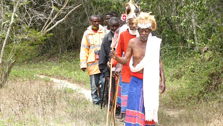 Mijikenda Kaya Elders walk out of Kaya Fungo shrine in Kaloleni, Kilifi county