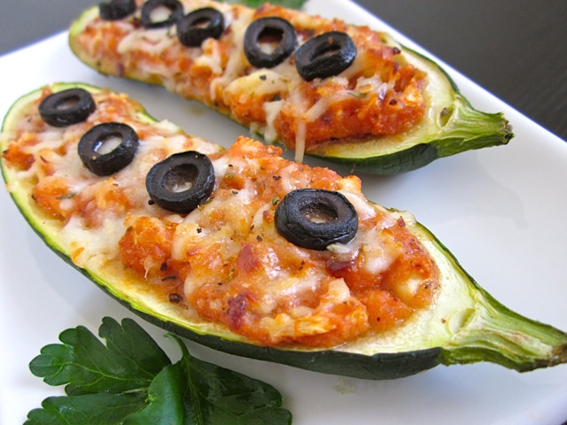 stuffed zucchini pizzas topped with olives 