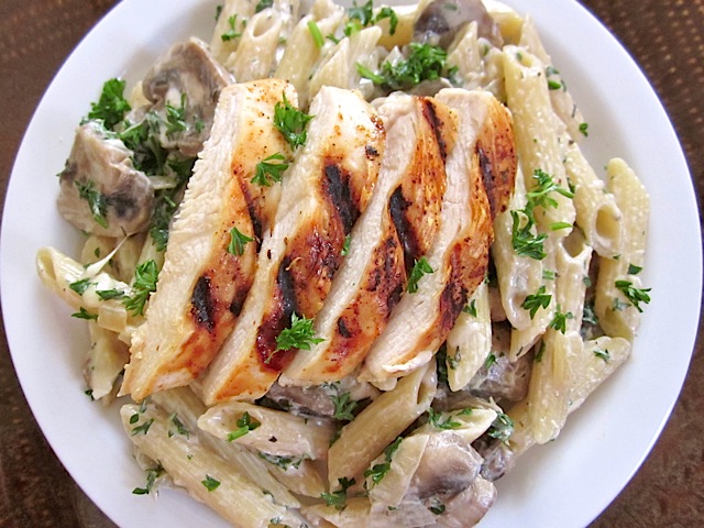 Top view of plate of creamy mushroom pasta with chicken