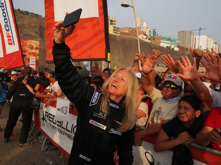 Andrea Peterhansel on the podium at the start of the 2019 Dakar Rally.