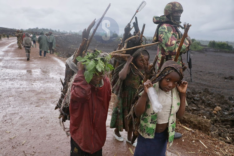 Traders at Goma Kibumba Rumagambo road heading to a local market to sell and buy food stuff in Goma on April 18 2023. Kenya Defence Forces has been in Eastern DRC since November 12, 2022 under the regional force EACRF to restore peace and stability in the war torn country.