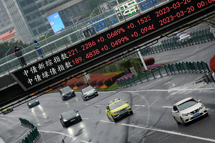 An electronic board at the Lujiazui financial district in Shanghai, China, March 21 2023. Picture: ALY SONG/REUTERS