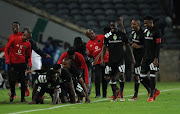 Orlando Pirates' striker Bernard Morrison celebrates with teammates after scoring his second goal in a 2-0 Nedbank Cup Last 32 win over Ajax Cape Town at Orlando Stadium on February 10, 2018 in Johannesburg, South Africa. 