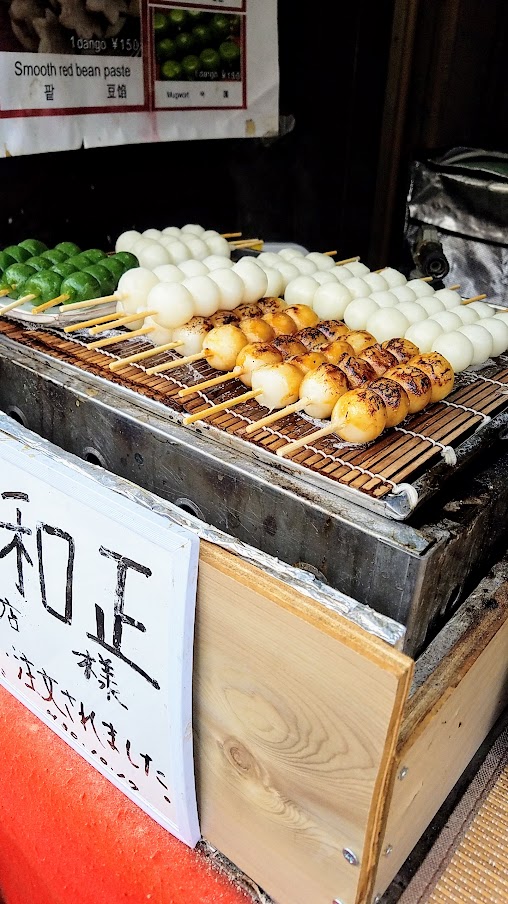 Hiroshima Day trip to Miyajima - dango stop at a stand just between Miyajimaguchi Station and the ferry to Miyajima