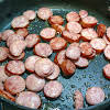 Thumbnail For Browning Slices Of Sausage.