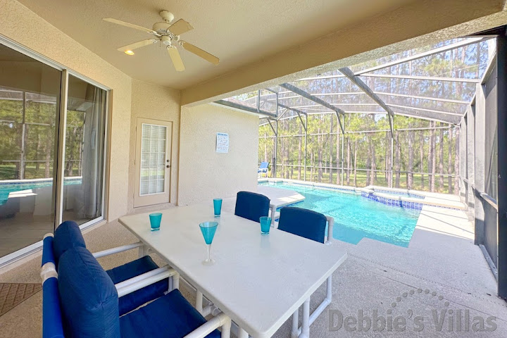 Enjoy alfresco dining beside the pool at this Davenport vacation villa