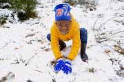 Mthibe Ndiweni, 6, spent  Thursday afternoon playing in the snow with his family in Hogsback