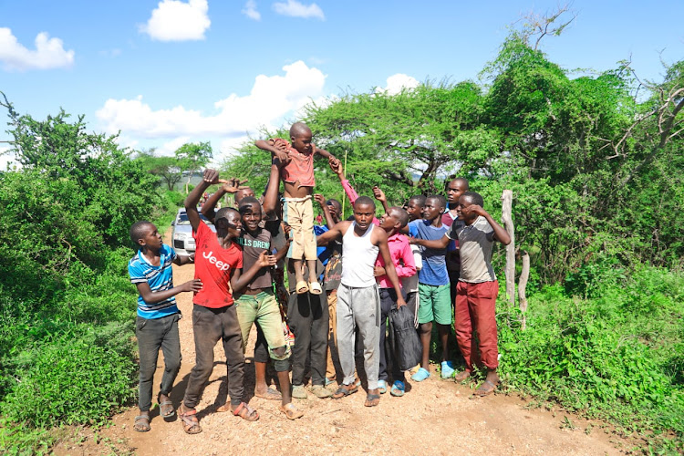 Five-year-old Mutuku Kioko embraced by his family upon being saved by the NPS after he was marooned by floods at Nduani in Yatta, Machakos County on April 23, 2024.