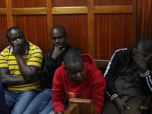 Four of the seven suspects Antony Wafula,Gilbert Kirunja,David Lukaya and William Malala at a Milimani court on Monday, February 25 for allegedly using the name of President Uhuru Kenyatta and mimicking him in which they received Shs 10 Million from a businessman over a land transaction. PHOTO/COLLINS KWEYU