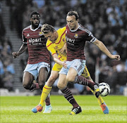 HAMMER DOWN
      : Liverpool's Lucas Leiva competes with West Ham United's Mark Noble during their Premiership match at Boleyn Ground in London 
      Photo: John Powell/Getty Images