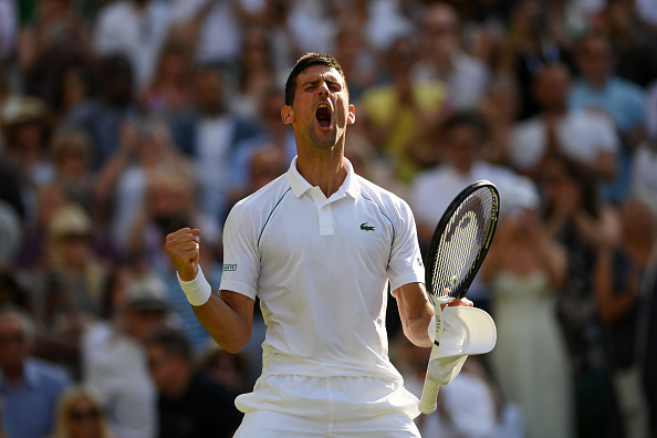 Novak Djokovic of Serbia celebrates match point against Cameron Norrie of Great Britain during the Mens' Singles Semi Final match on day twelve of The Championships Wimbledon 2022 at All England Lawn Tennis and Croquet Club on July 08, 2022 in London, England.