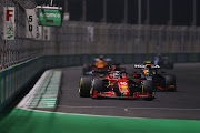 Charles Leclerc leads Sergio Perez during the F1 Grand Prix of Saudi Arabia at Jeddah Corniche Circuit on December 05, 2021 in Jeddah, Saudi Arabia.