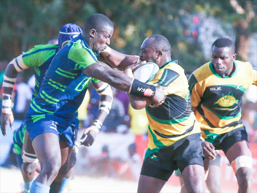 Andrew Amonde (L) of KCB tackles Dan Sikuta of Kabras during their Kenya Cup tie at Impala grounds. KCB won 44-20. February 23, 2019. Photo/Jack Owuor.jpg