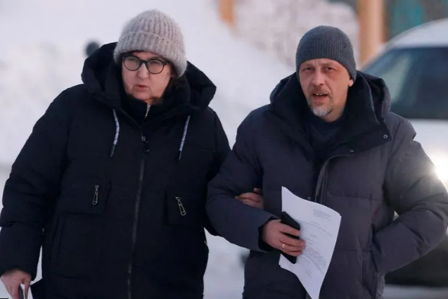 Alexei Navalny's mother Lyudmila and lawyer Vasily Dubokov (right) in a town close to the penal colony where the opposition leader died